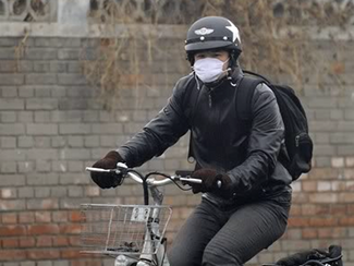 Bike Commuter with Face Mask