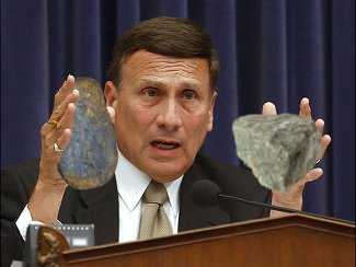 John Mica Holding Rocks